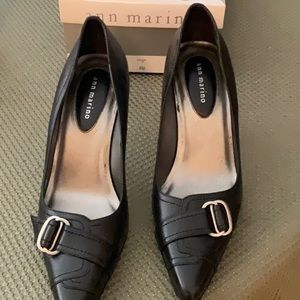 Black genuine leather high heel shoes. Size 8 M and brand new never worn.